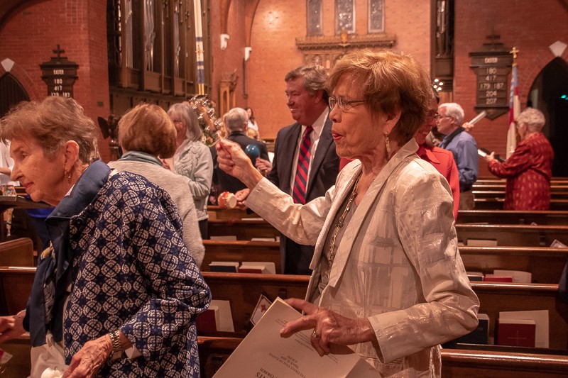 church congregation celebrating with musical instruments