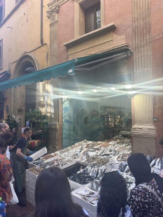a fish-selling market stall in an Italian city street