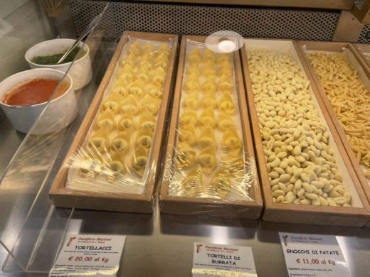 various types of pasta on display in a shop