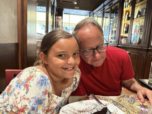 a child and an adult at a restaurant