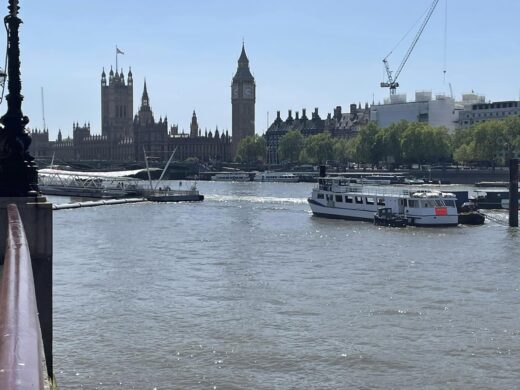 A river view of the Houses of Parliament in London, UK